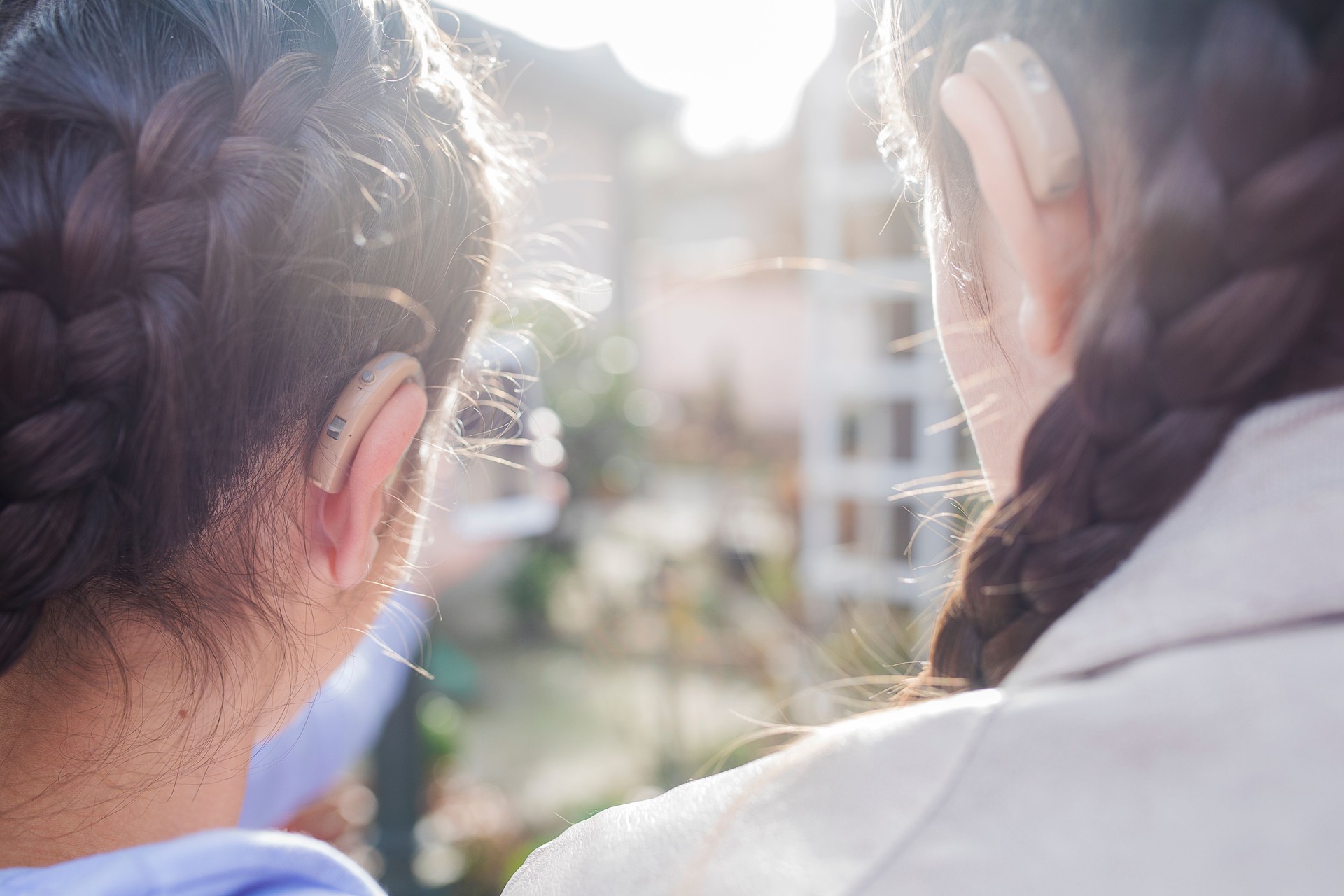 Teen girls with hearing aid